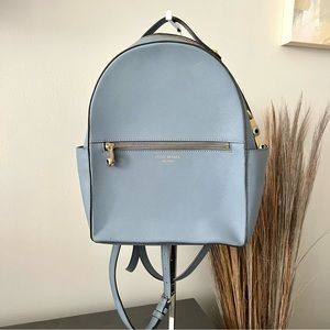 Henri bendel blue & gold hardware zip front backpack bag.